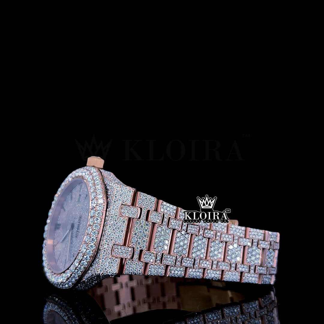 Rose gold fully iced out AP Moissanite diamond watch with a shimmering diamond-studded case and bright white dial.